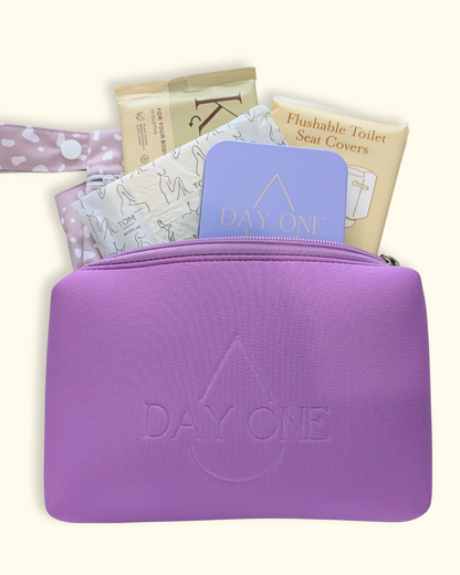 purple period kit for girls with all the inclusions such as: pill storage tin, flushable toilet seat covers, flushable wipes, reusable wet bag, and menstrual pads. perfect period kit for girls.