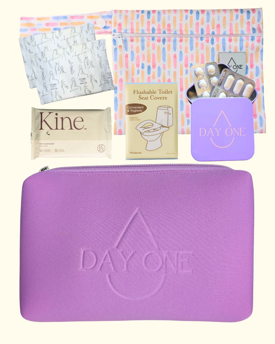 purple period kit lay flat with all the inclusions such as: pill storage tin, flushable toilet seat covers, flushable wipes, reusable wet bag, and menstrual pads. perfect period kit for girls.