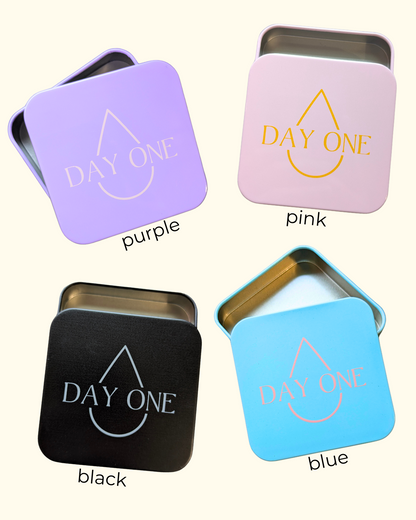 The pill storage tins in purple, pink, blue, and black. perfect for storing pain relief in your period kit.